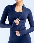 Navy blue long-sleeve athletic top on a plain background