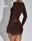 Brown sequin dress on a plain background
