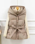 Beige puffer vest with a belt on a white background