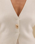 V-Neck, Buckle Closure, and Slit Detail