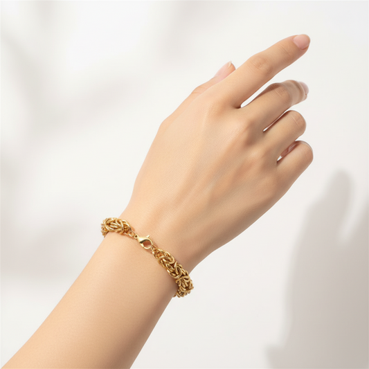 Gold bracelet on a white background