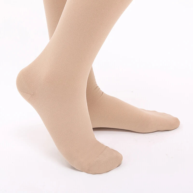 Beige tights worn by a person on a white background