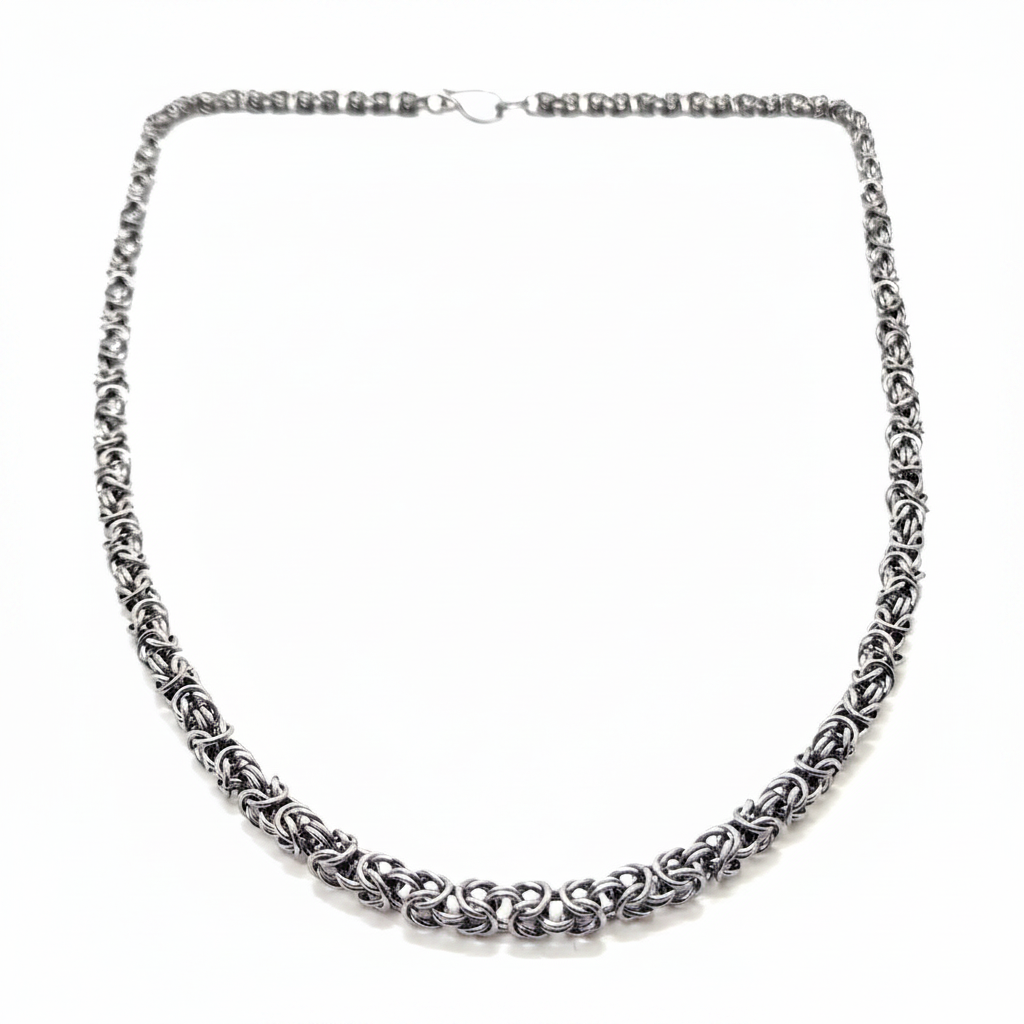 Silver chain necklace on a white background