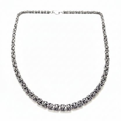 Silver chain necklace on a white background