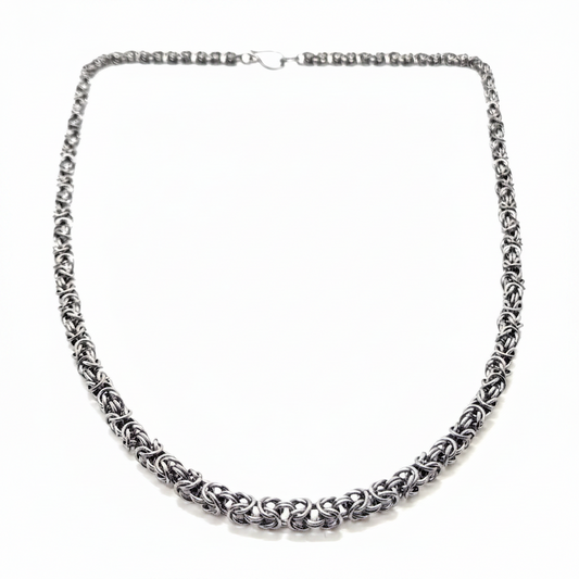 Silver chain necklace on a white background