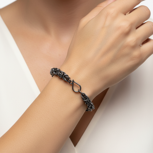 Silver chain bracelet on a white background