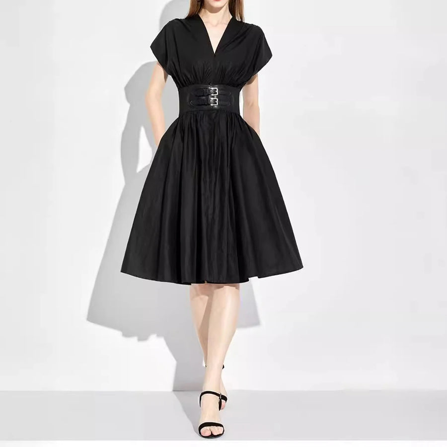 Black dress with a belt on a white background