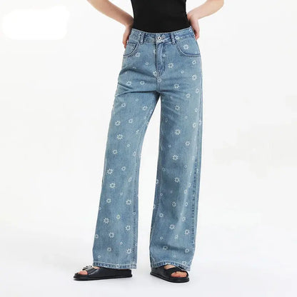 Light blue jeans with floral patterns worn by a person on a white background, featuring the brand 'SEMIR'.