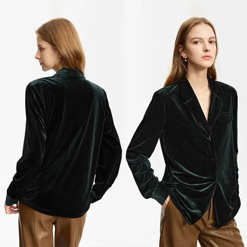 Black velvet blazer worn by a model on a white background