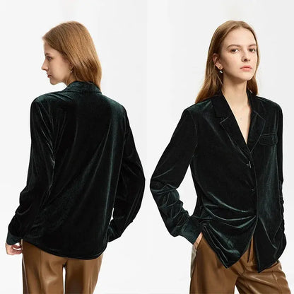 Black velvet blazer worn by a model on a white background