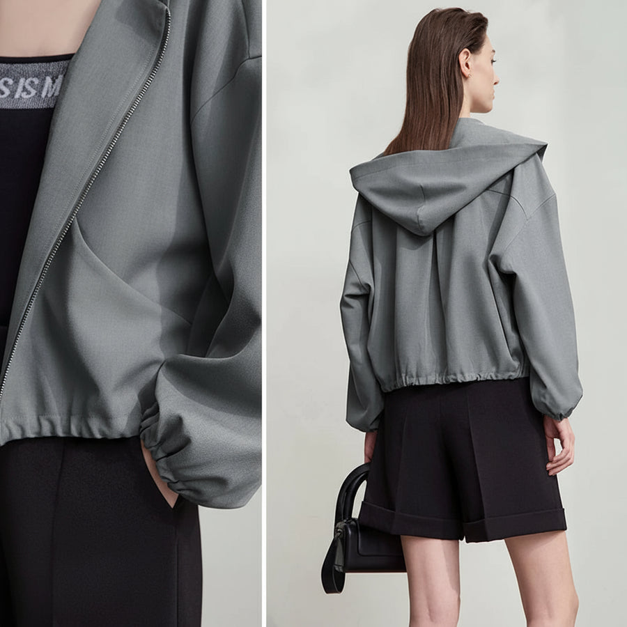 Gray hooded jacket worn by a model on a plain background, with 'Amii' branding.