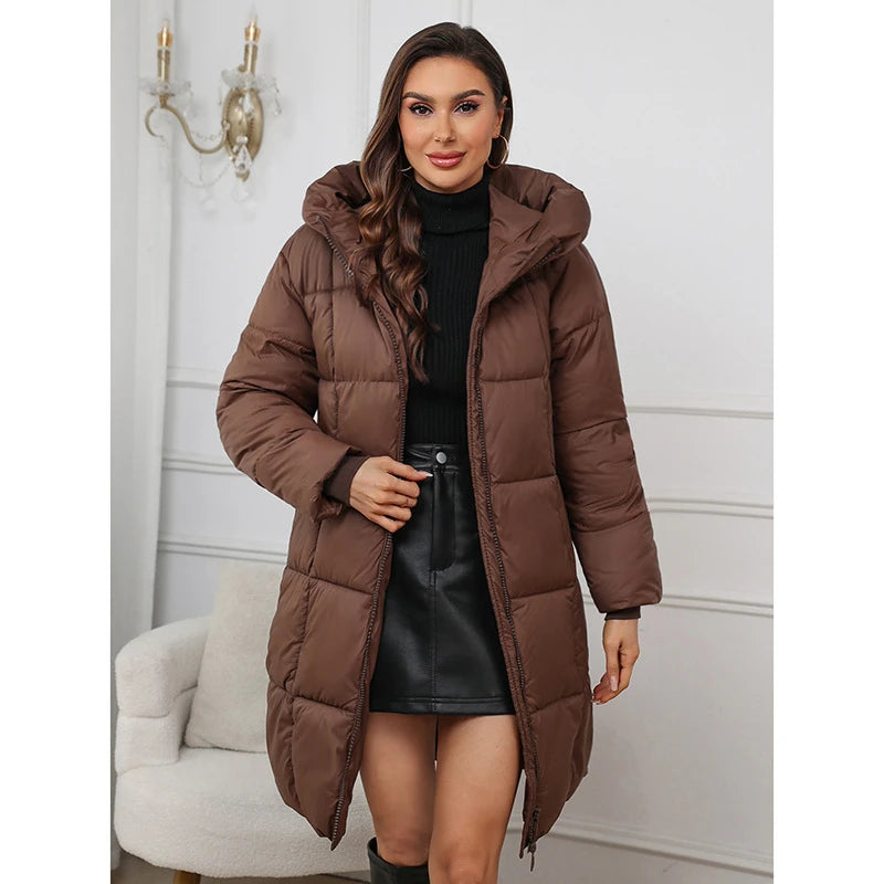 Woman wearing a brown puffer coat in an indoor setting