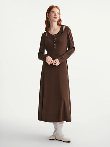 Woman wearing a brown dress on a white background