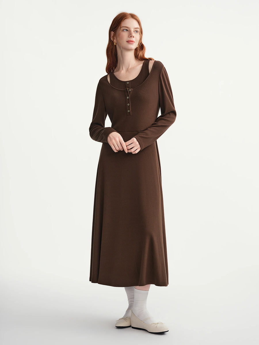 Woman wearing a brown dress on a white background