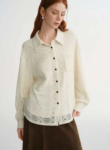 Woman wearing a cream-colored textured shirt with black buttons on a white background, featuring the brand 'DUSHU'.
