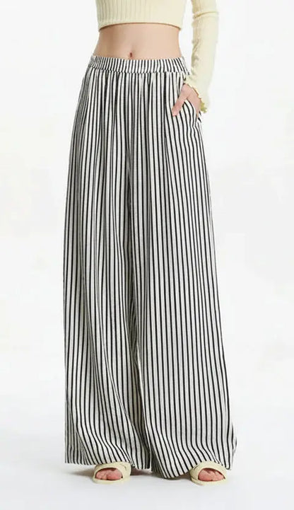 Black and white striped wide-leg pants on a white background
