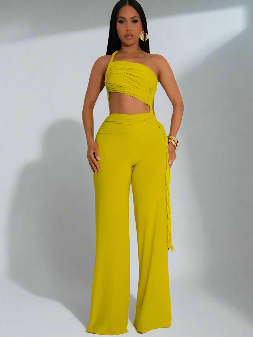 Woman wearing a yellow outfit with a white background