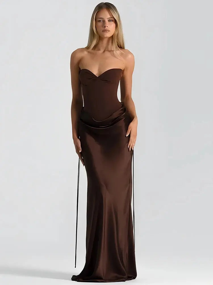 Woman wearing a brown strapless gown on a white background