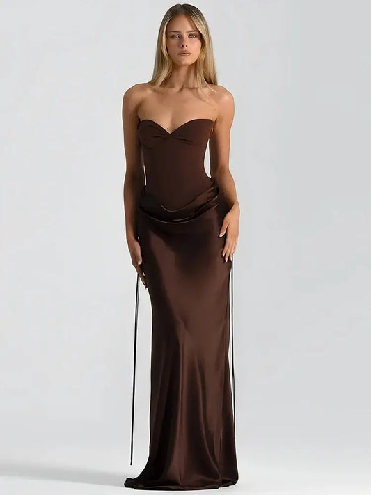 Woman wearing a brown strapless gown on a white background