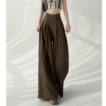 Brown wide-leg pants worn by a person on a white background