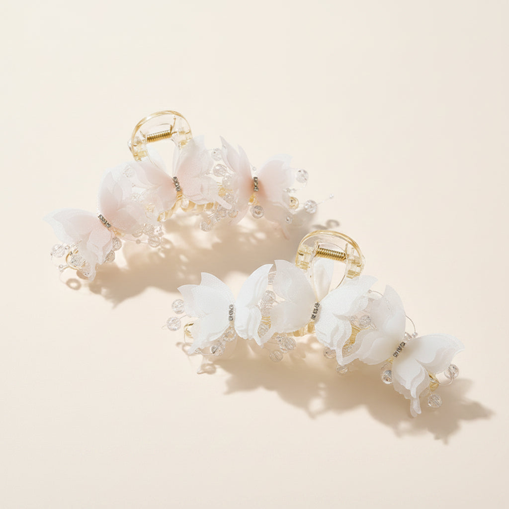 Decorative hair clips with floral designs on a wooden surface