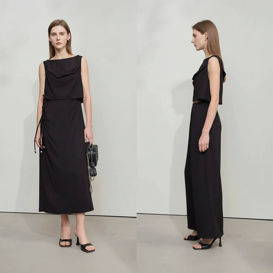 Two models wearing black sleeveless dresses from the brand Amii on a plain background.