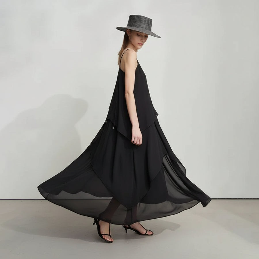 Woman wearing a black dress and gray hat against a white background, with 'Amii' brand visible.