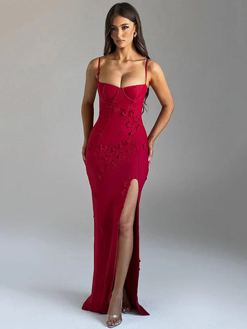 Red evening gown with a high slit on a gray background