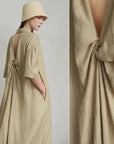 Beige dress with open back and short sleeves, featuring the brand 'Amii'.